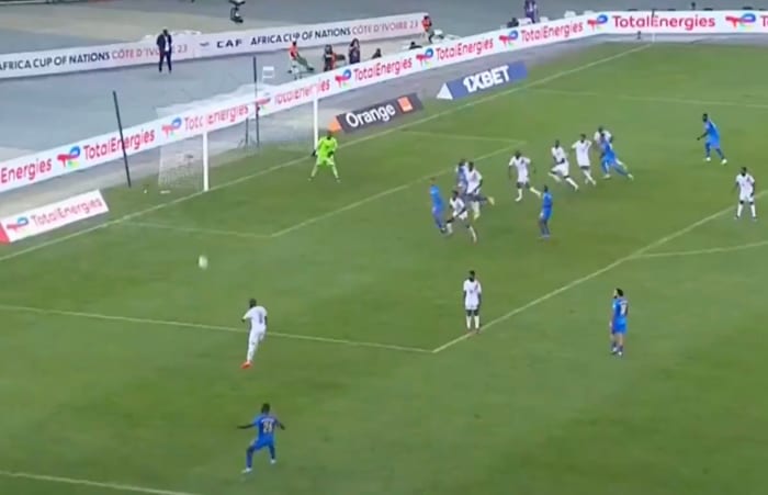 Arthur Masuaku pictured (bottom) moments after shooting from a wide free-kick that resulted in an amazing goal for DR Congo against Guinea at the 2023 Africa Cup of Nations